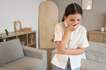 Cute girl feeling unwell at home