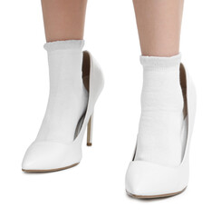 Little girl wearing oversized high heeled shoes on white background, closeup