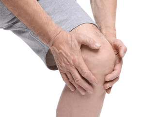 Senior man suffering from knee pain on white background, closeup