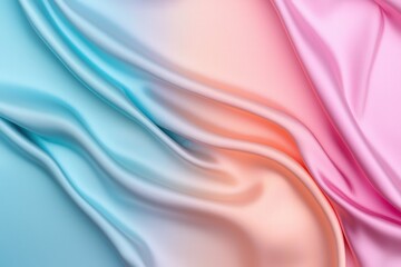 Obraz premium A smooth, flowing fabric showcases a gradient of soft blue and pink hues, creating a serene and elegant visual texture.