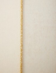 Elegant Gold Glitter Border on Textured Ivory Fabric Background Design