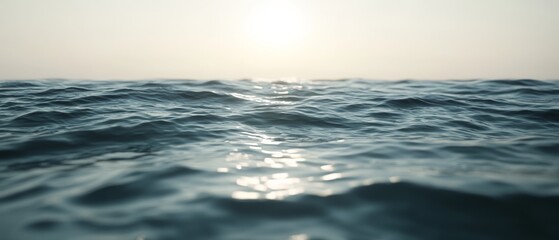 Obraz premium The ocean is calm and the sun is setting, creating a serene