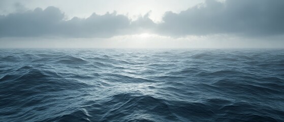 Fototapeta premium The ocean is calm and peaceful, with a few clouds in the sky