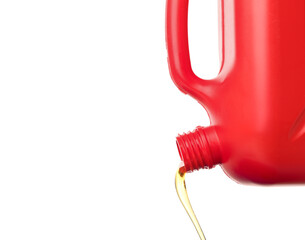 Pouring of gasoline from canister on white background