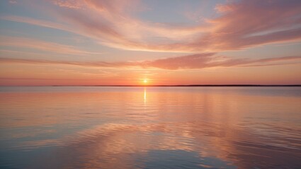 Obraz premium Serene Sunset Over Still Waters with Soft Pastel Colors Creating a Peaceful Atmosphere and Warm Golden Reflections in the Sky.