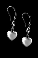 Heart earrings on black