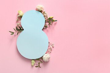 Figure 8 made of paper with beautiful flowers on pink background. International Women's Day...