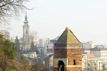 Cityscape: View of Belgrade from Kalemegdan. A close-up of the brick watchtower against the...