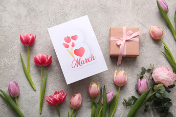 Greeting card with beautiful tulip flowers and gift box on grey background. International Women's Day celebration