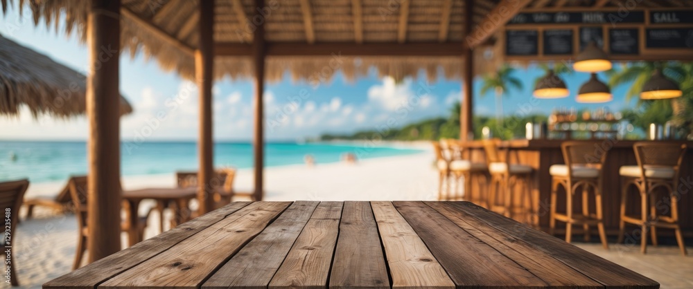 Poster tropical resort bar with empty wooden table top for display or montage in relaxing beach setting wit