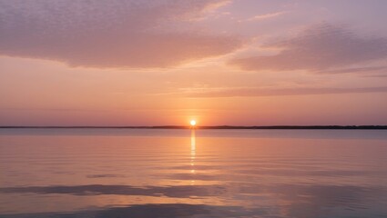 Obraz premium Serene Sunset Reflection Over Calm Waters Illuminating the Sky with Warm Pastel Hues Creating a Peaceful and Tranquil Atmosphere.