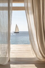 A picturesque sailing scene viewed through sheer curtains, enhancing the beauty of the tranquil seascape outside.