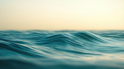 Obraz premium Serene Blue Ocean Waves Gently Rolling Under Soft Sunset Light