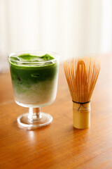 Iced matcha latte, authentic japanese matcha latte drink in a glass.