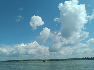 On a river summer fishing trip on a cloudy day.