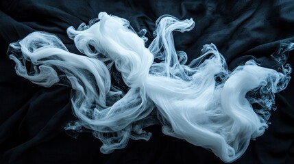 Fototapeta premium Ethereal White Smoke Against Dark Fabric Background for Creative Use