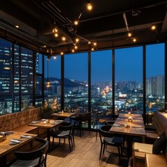 A restaurant setting with a city view at dusk