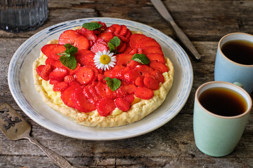 Tart with custard, strawberries. Chamomile, mint, summer.