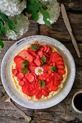 Tart with custard, strawberries. Chamomile, mint, summer, piece of cake.