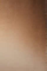 Soft and elegant abstract background featuring a smooth gradient of mocha mousse tones.