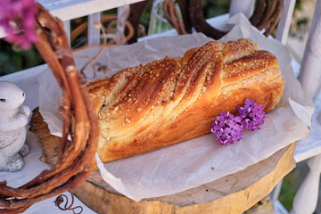 Babka with almonds. Side view, lilac, spring, buffet.