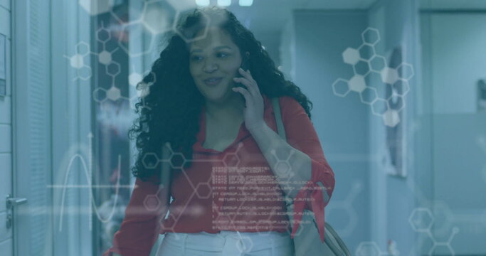 Image of data processing and chemical formula over biracial businesswoman talking on smartphone