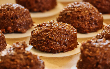 gingerbread dough with chocolate and nuts on wafer right before baking making the mouth water
