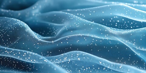 Soft, silky blue fabric adorned with scattered white dots, exuding smooth, wavy elegance. A tactile embrace of comfort and charm in every detail