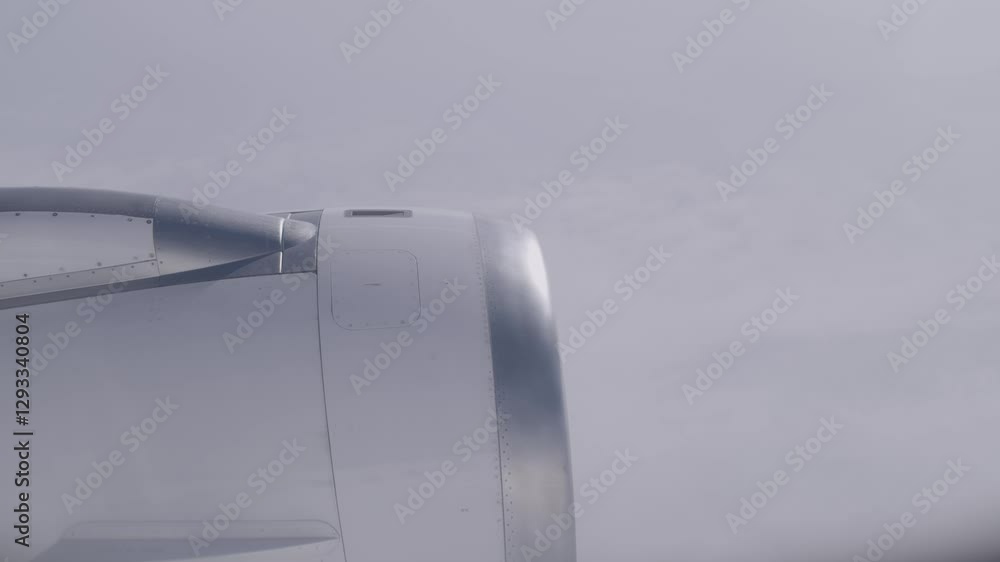 Aufkleber airplane engine in-flight view with cloudy sky in the background