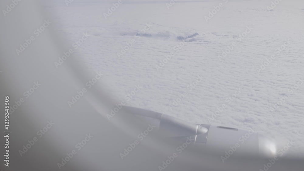 Poster view from airplane window over clouds with wing visible, creating a calm, airy mood