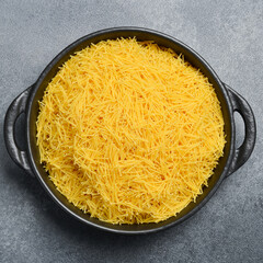 Raw Italian Vermicelli in a bowl. Cooking background. Italian food concept.