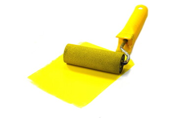 Painting a rough wall with roller. Paint roller leaving stroke of yellow color over a white background. usable for text and messages.