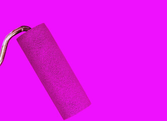 Painting a rough wall with roller. Paint roller leaving stroke of pink color over a white background. usable for text and messages.