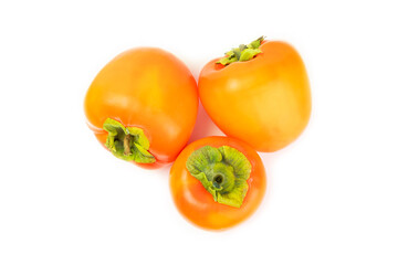 Persimmon isolated on white background. Persimmon fruit. Slice of ripe, juicy, sweet persimmon fruit. Vegan. Fruit garden. Close-up.
