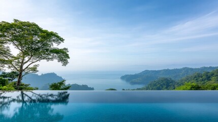 Obraz premium Serene Infinity Pool Overlooking Lush Green Hills and Ocean View