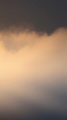 Fototapeta premium Calm abstract background featuring soft clouds in a gradient of warm tones perfect for mobile wallpaper