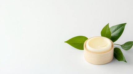 Natural Cream in Wooden Container with Fresh Green Leaves
