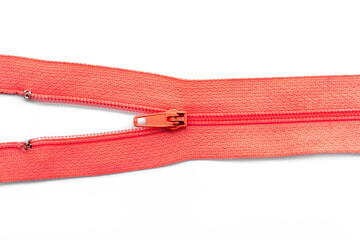 Red zipper isolated on white, top view