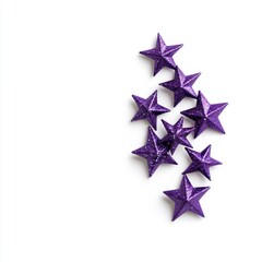 Obraz premium Purple glitter stars scattered on a white background. Festive, decorative, and minimalist design. Ideal for holiday or celebration themes