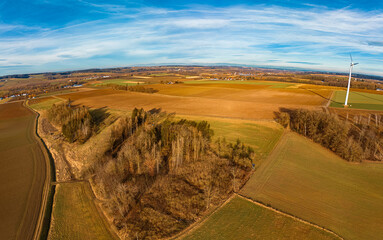 High resolution stitched winter drone panorama captured in flight near two wind power plants at...