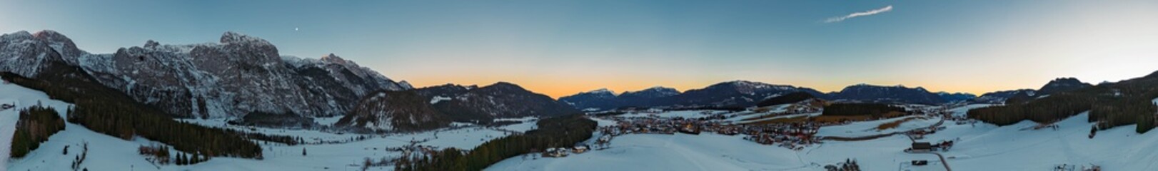 High resolution stitched winter drone panorama captured in flight with the Tennengebirge mountains near Abtenau, Hallein, Salzburg, Austria