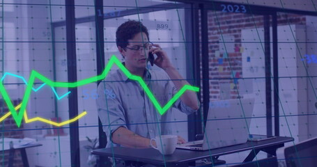 Image of financial data processing over caucasian businessman using smartphone in office