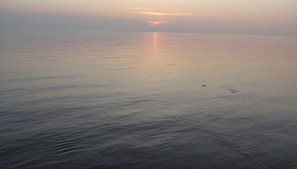 Fototapeta premium Tranquil Lake with Soft Pastel Sunset Reflections