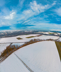 High resolution stitched winter drone panorama captured in flight near a chapel at Landau an der...