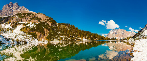 High resolution stitched alpine summer panorama with reflections at Lake Seebensee, Ehrwald,...