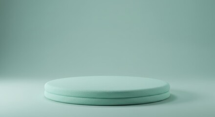 A smooth, circular podium stands prominently against a soft, solid backdrop, providing a minimalist space ideal for speeches or award ceremonies