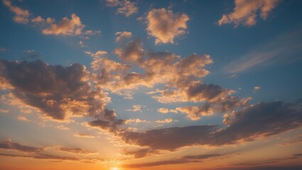 Obraz premium Evening Sunset Sky with Vivid Clouds and Warm Colors Creating a Serene and Beautiful Atmosphere for Background or Art Projects.