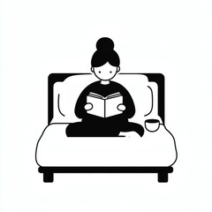 Happy woman reading a book while sitting comfortably on her bed in a cozy room