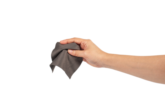 Hand and crumpled microfiber cleaning cloth, isolated on transparent background