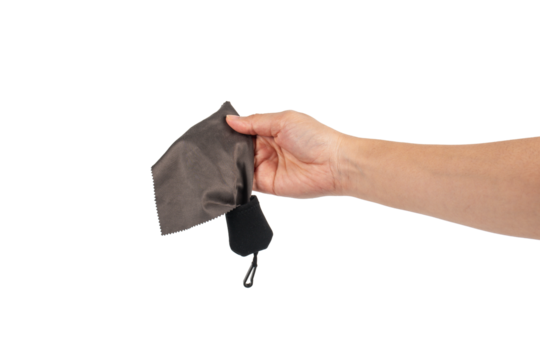 Hand and crumpled microfiber cleaning cloth, isolated on transparent background